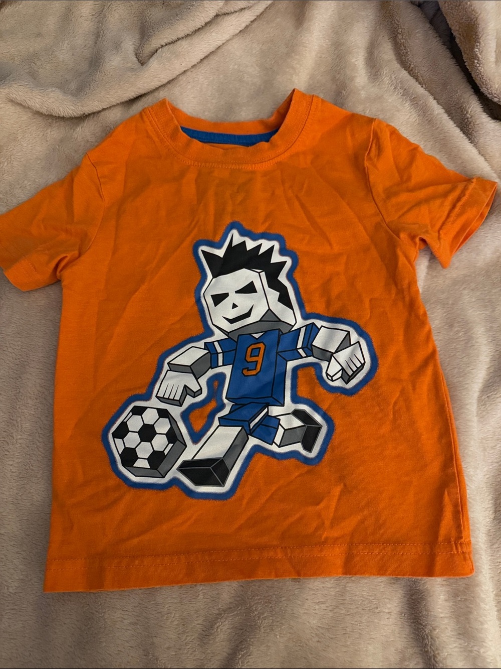 5/$25 Athletic Works Orange Tee with Blue Soccer Player Graphic